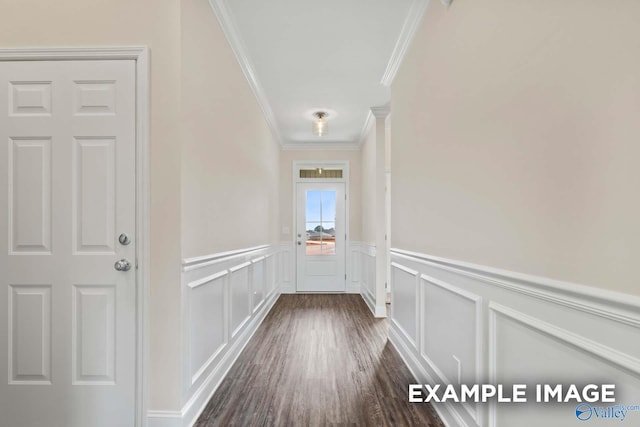 doorway featuring ornamental molding and dark hardwood / wood-style flooring