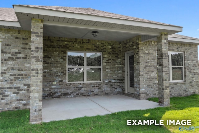 property entrance featuring a patio