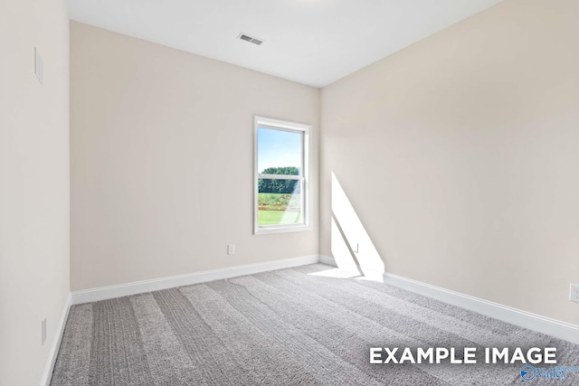 empty room featuring carpet flooring