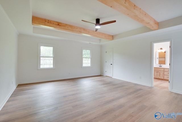 unfurnished bedroom with beamed ceiling, a sink, light wood-style flooring, and baseboards
