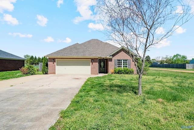 424 Banyon Rd, Toney, AL 35773 - ranch-style home featuring roof with shingles, driveway, an attached garage, a front yard, and brick siding