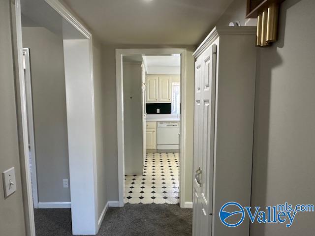 corridor with dark carpet