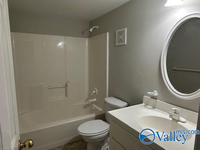 full bathroom with vanity, toilet, and bathing tub / shower combination