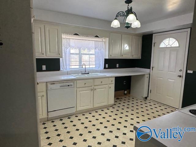 kitchen with pendant lighting, sink, and dishwasher