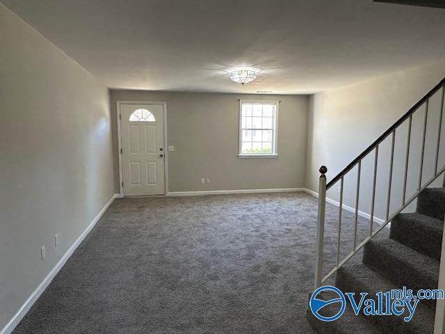entrance foyer with carpet floors