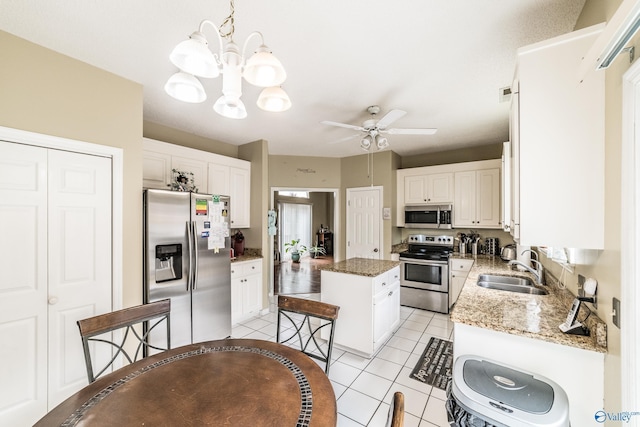 106 Spinnaker Ridge Dr, Huntsville, AL 35824 - kitchen with a center island, a sink, white cabinetry, and stainless steel appliances