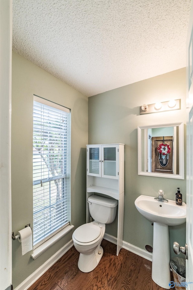 106 Spinnaker Ridge Dr, Huntsville, AL 35824 - bathroom featuring a sink, toilet, a textured ceiling, baseboards, and wood finished floors