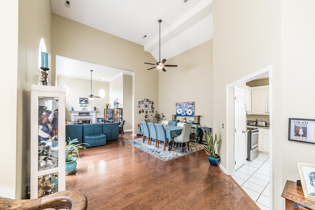 106 Spinnaker Ridge Dr, Huntsville, AL 35824 - interior space with baseboards, high vaulted ceiling, ceiling fan, and light wood finished floors