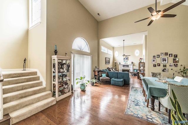 106 Spinnaker Ridge Dr, Huntsville, AL 35824 - dining space with a ceiling fan, wood finished floors, high vaulted ceiling, and stairway