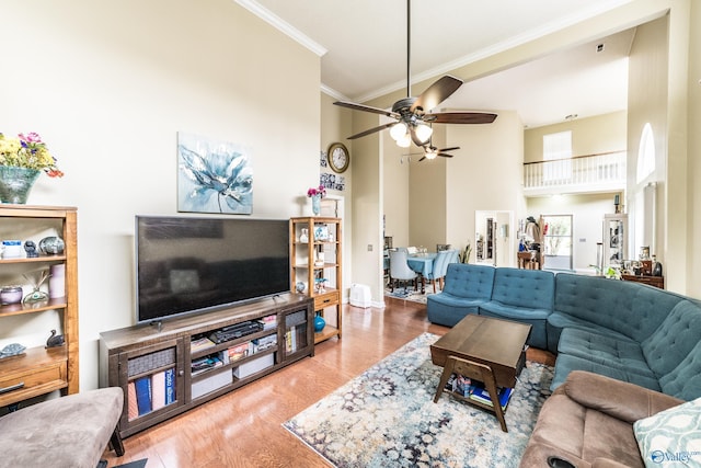 106 Spinnaker Ridge Dr, Huntsville, AL 35824 - living area featuring a high ceiling, ornamental molding, ceiling fan, and wood finished floors