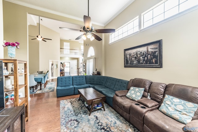 106 Spinnaker Ridge Dr, Huntsville, AL 35824 - living room featuring crown molding, a ceiling fan, a towering ceiling, and wood finished floors