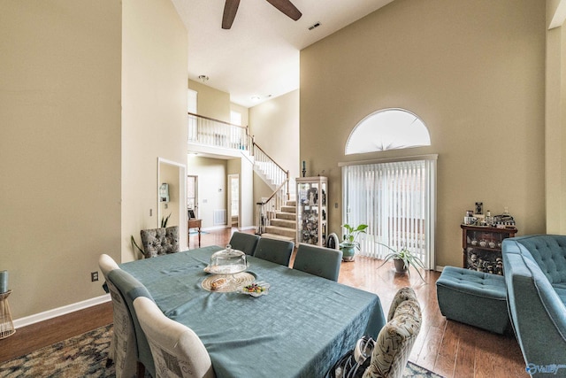 106 Spinnaker Ridge Dr, Huntsville, AL 35824 - dining room with a healthy amount of sunlight, a ceiling fan, stairs, and a towering ceiling