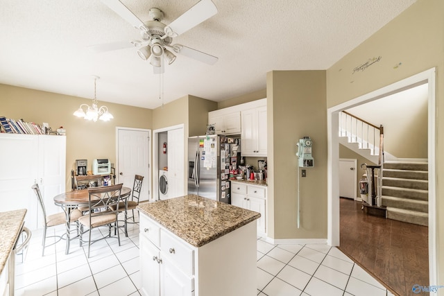 106 Spinnaker Ridge Dr, Huntsville, AL 35824 - kitchen featuring a ceiling fan, decorative light fixtures, white cabinets, stainless steel fridge, and light tile patterned flooring