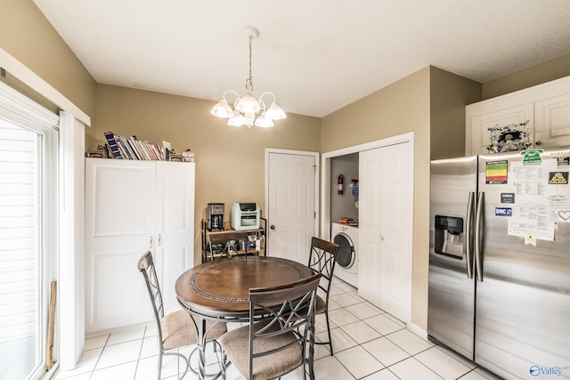 106 Spinnaker Ridge Dr, Huntsville, AL 35824 - dining room featuring washer / dryer, light tile patterned floors, and a notable chandelier