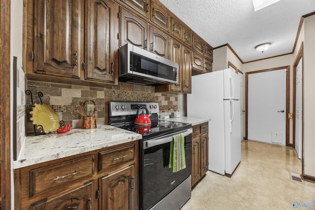 2009 Rangewood Cir, Huntsville, AL 35803 - kitchen with appliances with stainless steel finishes, tasteful backsplash, a textured ceiling, dark brown cabinets, and crown molding
