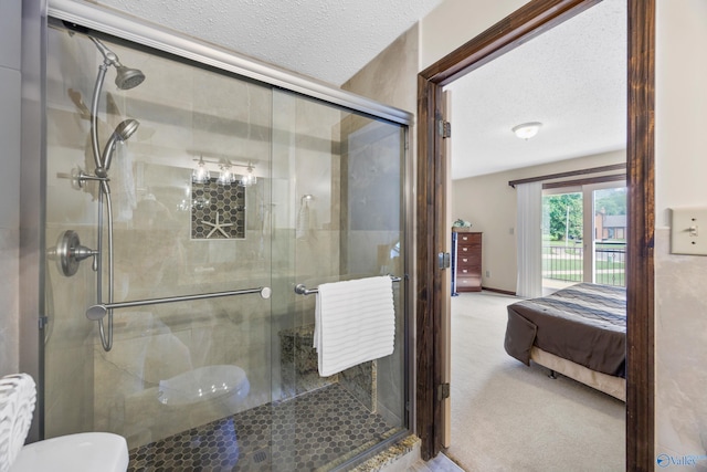 2009 Rangewood Cir, Huntsville, AL 35803 - bathroom with connected bathroom, a textured ceiling, a stall shower, and toilet