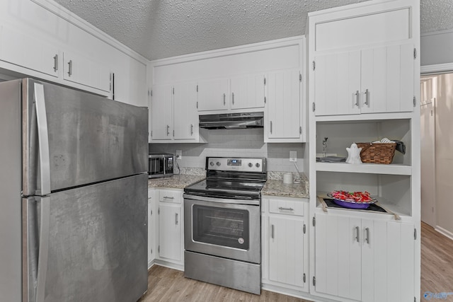 kitchen featuring a textured ceiling, stainless steel appliances, light wood finished floors, and under cabinet range hood