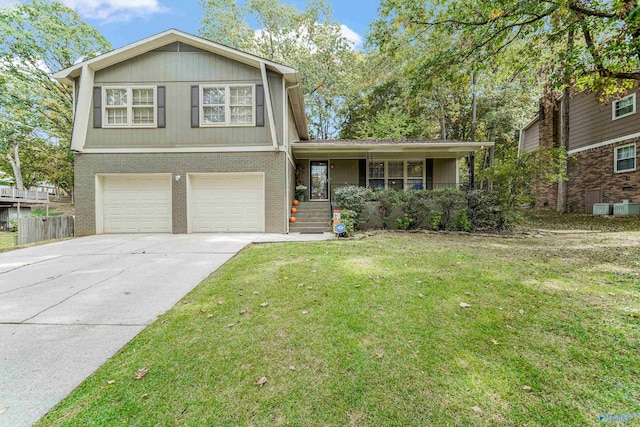 split level home with a front yard and a garage