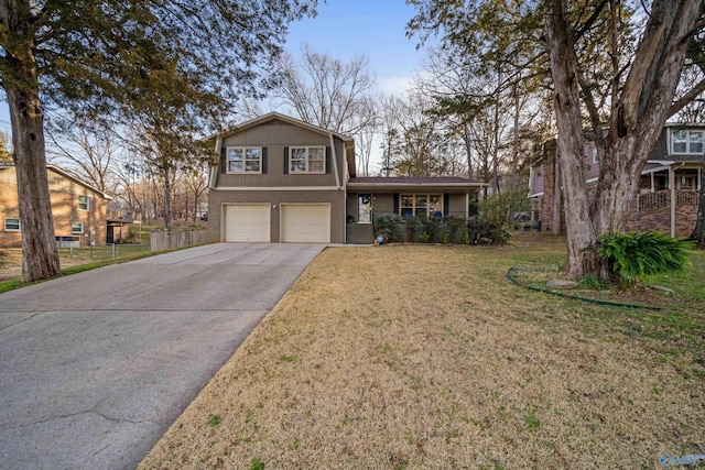 split level home featuring brick siding, concrete driveway, an attached garage, fence, and a front lawn