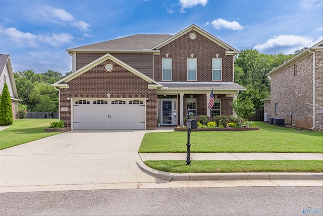 view of front of house with a garage and a front lawn