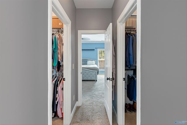 hallway with light colored carpet