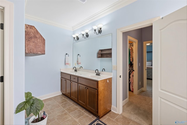 bathroom featuring crown molding and vanity