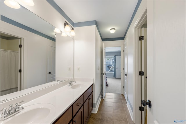 bathroom featuring tile patterned flooring and vanity