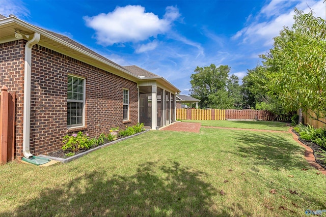 view of yard with a sunroom