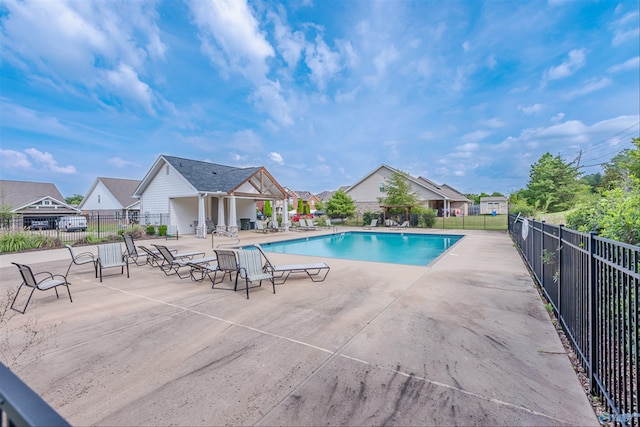 view of swimming pool featuring a patio area