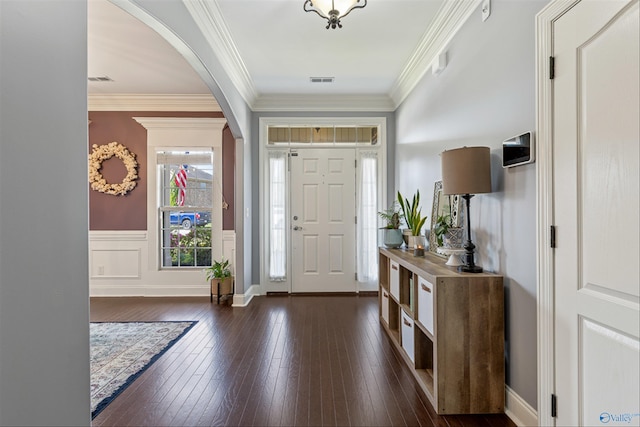 entryway featuring dark hardwood / wood-style flooring and ornamental molding