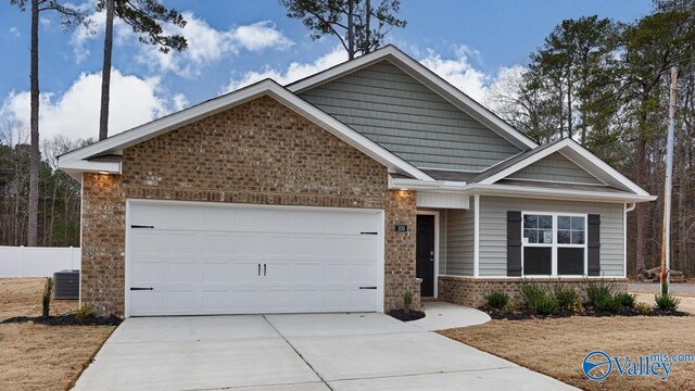 view of front of home with a garage and a front lawn