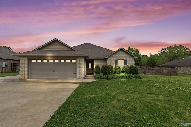 18226 Whitetail Ln, Athens, AL 35613 - ranch-style house featuring driveway, an attached garage, brick siding, and roof with shingles