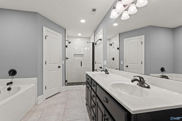 18226 Whitetail Ln, Athens, AL 35613 - full bathroom featuring a shower stall, a bath, tile patterned flooring, double vanity, and recessed lighting