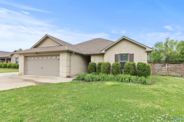 18226 Whitetail Ln, Athens, AL 35613 - view of front of home with a garage, brick siding, driveway, and a shingled roof