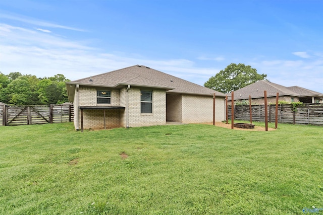 18226 Whitetail Ln, Athens, AL 35613 - rear view of house featuring brick siding and roof with shingles