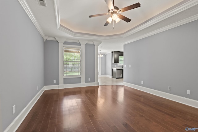 18226 Whitetail Ln, Athens, AL 35613 - unfurnished living room featuring plenty of natural light, a ceiling fan, hardwood / wood-style floors, decorative columns, and crown molding