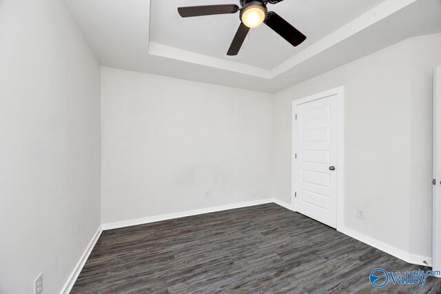 6032 Barringer Ct, Huntsville, AL 35806 - unfurnished room featuring a raised ceiling, a ceiling fan, dark wood-style floors, and baseboards