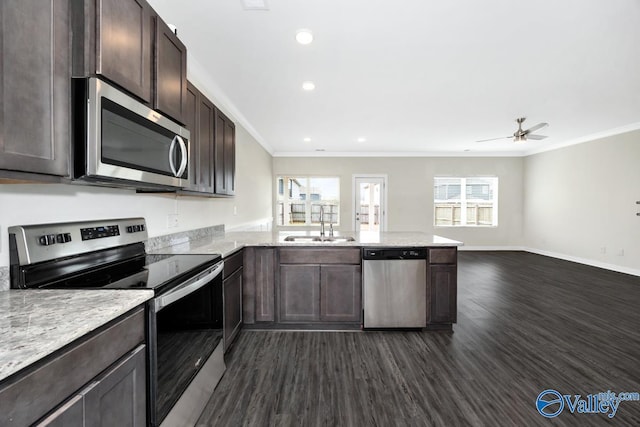 6032 Barringer Ct, Huntsville, AL 35806 - kitchen featuring dark brown cabinetry, a sink, ornamental molding, and appliances with stainless steel finishes