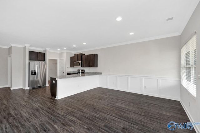 6032 Barringer Ct, Huntsville, AL 35806 - kitchen with stainless steel appliances, a peninsula, dark wood-style flooring, and dark brown cabinets