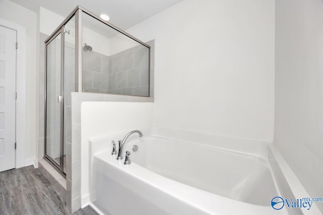 6032 Barringer Ct, Huntsville, AL 35806 - full bath with a stall shower, a garden tub, and wood finished floors