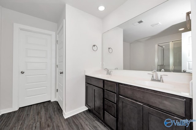 6032 Barringer Ct, Huntsville, AL 35806 - bathroom featuring baseboards, a shower stall, visible vents, a sink, and wood finished floors