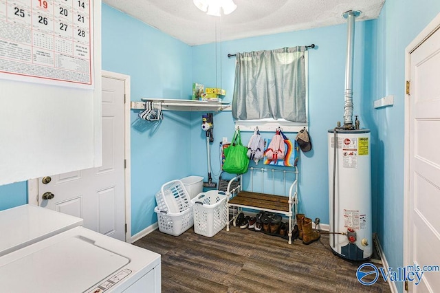 3392 Williams St, Hokes Bluff, AL 35903 - laundry room with water heater, wood finished floors, washing machine and dryer, and a textured ceiling