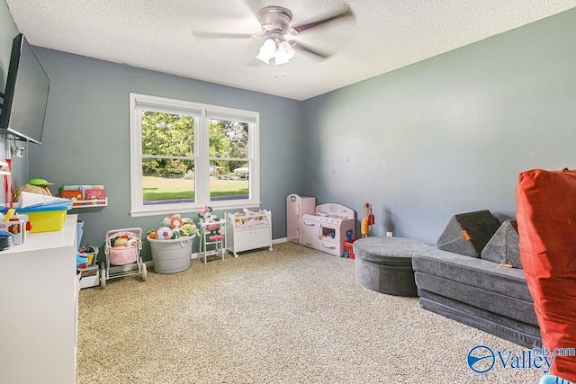 3392 Williams St, Hokes Bluff, AL 35903 - playroom with a ceiling fan, carpet floors, and a textured ceiling