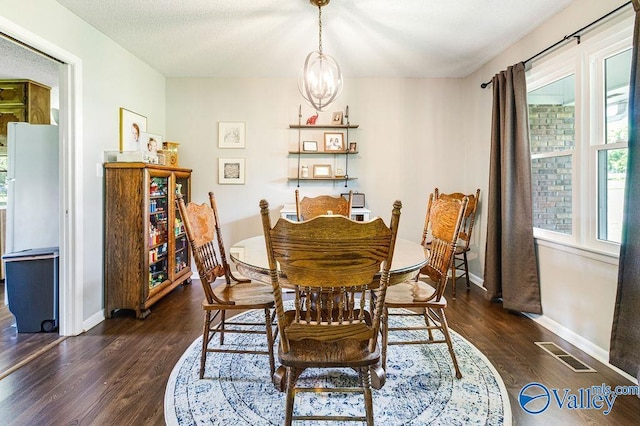 3392 Williams St, Hokes Bluff, AL 35903 - dining room featuring dark wood-style floors and a chandelier