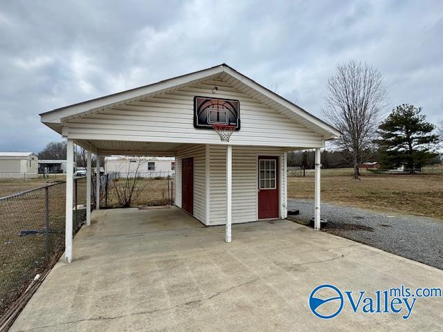 view of vehicle parking with a carport