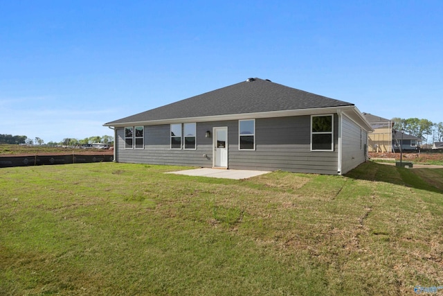 back of property featuring a yard and a patio area