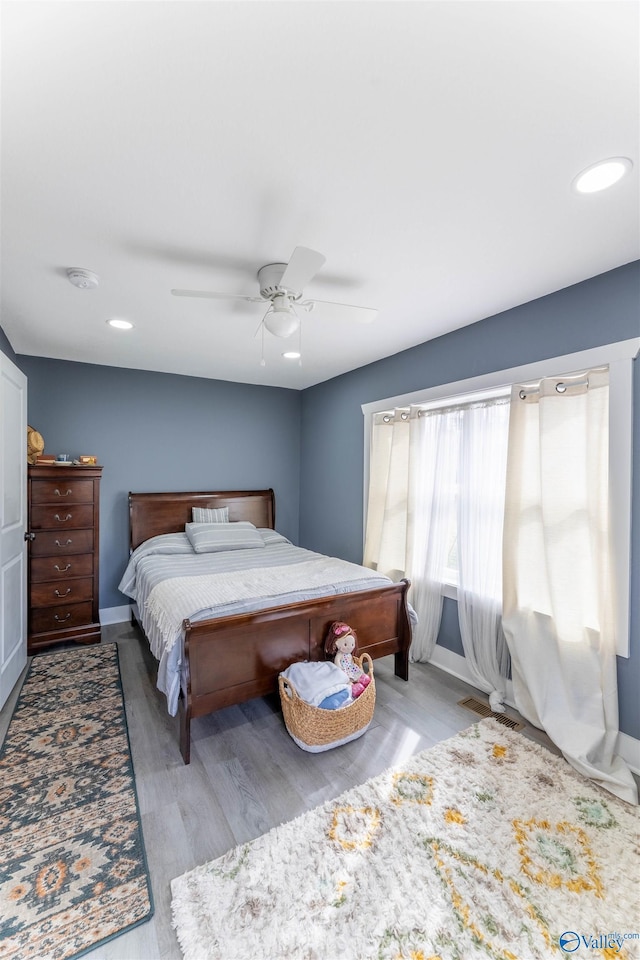 bedroom featuring ceiling fan and light hardwood / wood-style flooring