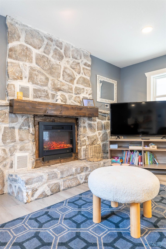 living room featuring a fireplace