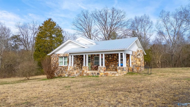 view of front of house with a front lawn and a porch