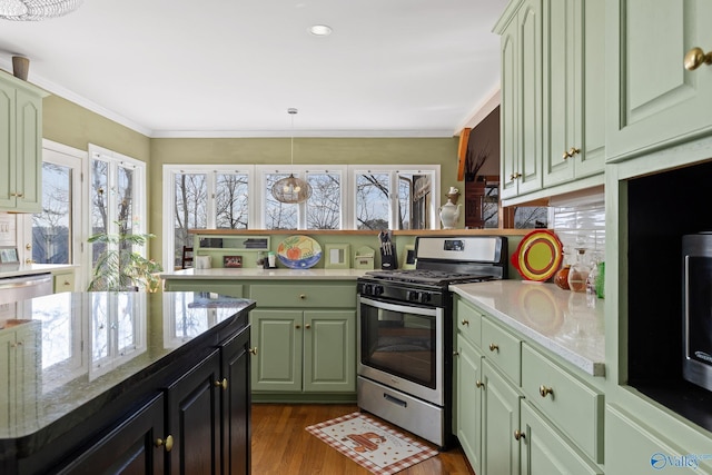 kitchen featuring appliances with stainless steel finishes, dark hardwood / wood-style floors, backsplash, hanging light fixtures, and ornamental molding